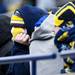 Michigan fans stay warm in the first row during the spring football game on Saturday, April 13. AnnArbor.com I Daniel Brenner